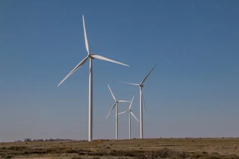 Wind farm with wind powered power generating turbines Stock Photos