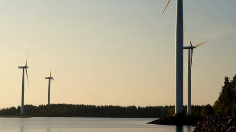 Wind farm, wind turbines during golden hour light. Video stock 117349615