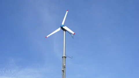 The wind farm is working. Stockbeeldmateriaal 157437489