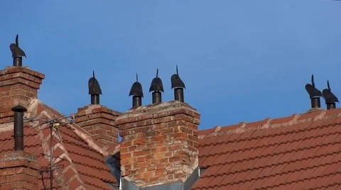 Wind flags mounted on chimneys rotate as the wind 스톡 동영상 60798818