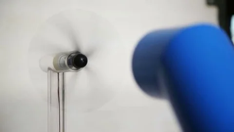 Wind force demonstration with a fan Stock Footage 69166703