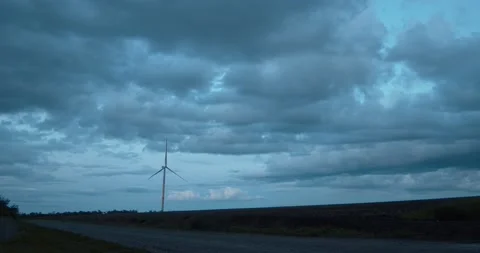 A wind generator against the backdrop of a beautiful evening sky. Stock Footage 131114623