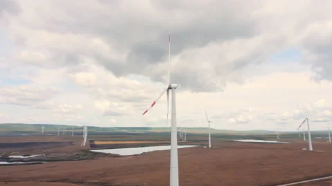 Wind generator at the alternative power station generates green clean energy Stock Footage 156600571