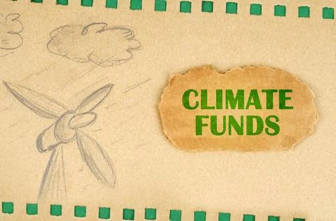 A wind generator and clouds are drawn on cardboard, next to it lies a cardb.. Stockillustratie