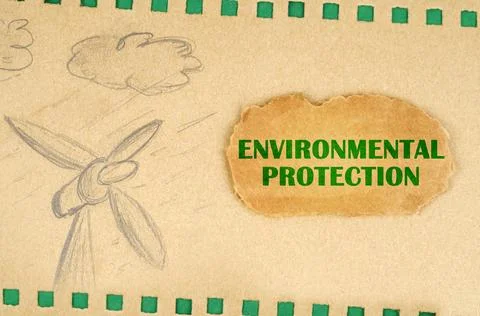 A wind generator and clouds are drawn on cardboard with green holes, next to  Fotos Stock