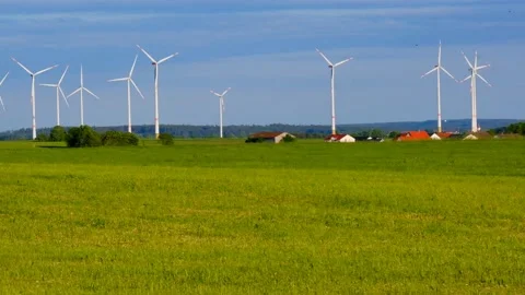 Wind generator and home set  in green field.renewable energy. Stock Footage 196374430