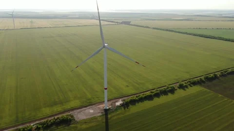 Wind generator and its shadow on a field with wheat part #03 库存影片 132202083