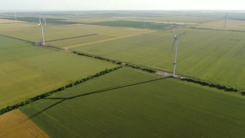 Wind generator and its shadow on a field with wheat part #01 Stock Footage 132202110