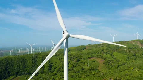 Wind generator on the green hilly peninsula of the Atlantic. Stock Footage 161087622