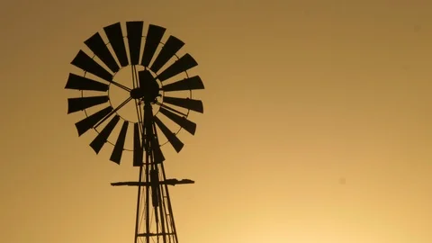 Wind generator in Namibia, Africa in 4K, sunset no cloud Stock Footage 91279584