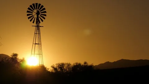 Wind generator in Namibia, Africa in 4K, sunset no cloud Stock Footage 91280311