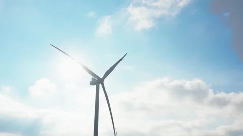 Wind generator in process of operation with sun behind Stock Footage 260607145