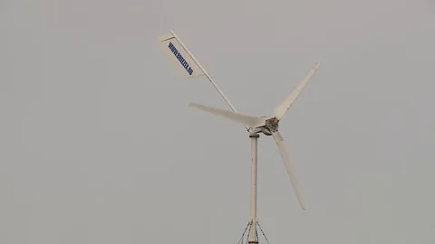 Wind generator rotates slowly in the wind Stock Footage 80299678