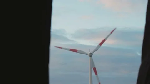 Wind generator rotating against the background of the evening sky. View from the Stock Footage 235693065