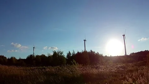 Wind generator at sunset Stock Footage 76317702