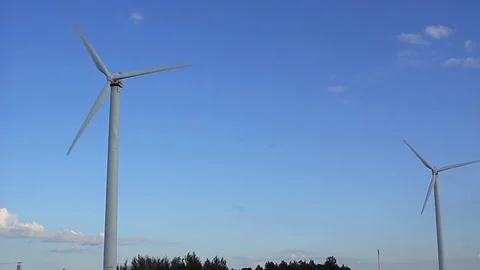 Wind generator at sunset Stock Footage 76359924