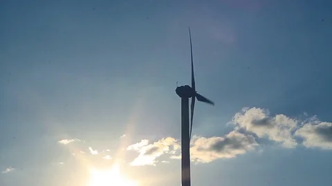 Wind generator at sunset Stock Footage 76360621