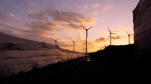Wind generators and power lines silhouette. Stock Footage 97464693