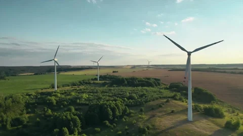 Wind generators on the background of the setting sun top view from a drone Stock Footage 135886349