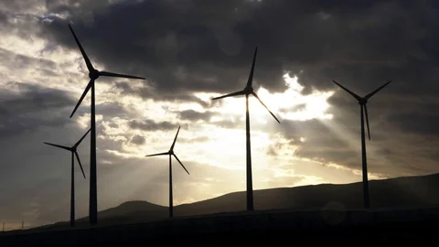 Wind generators lined up against sunset. Stock Footage 97463635