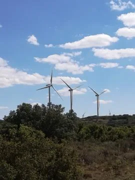 Wind generators on the mountain with blue sky Stock Photos