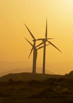 Wind generators in the mountains at sunset Stock Photos