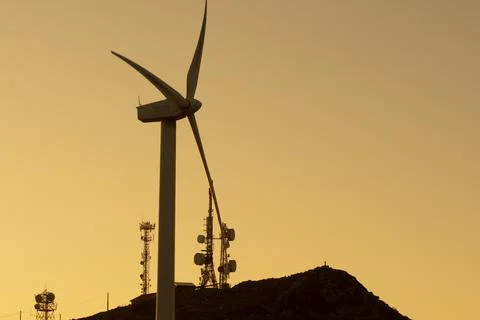 Wind generators in the mountains at sunset Stock Photos