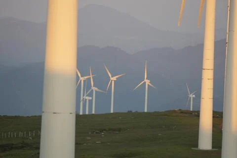 Wind generators in the mountains at sunset Stock Photos