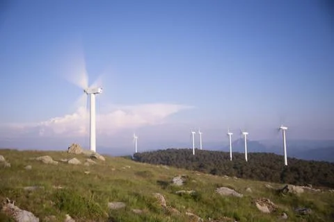 Wind generators in the mountains at sunset Stock Photos