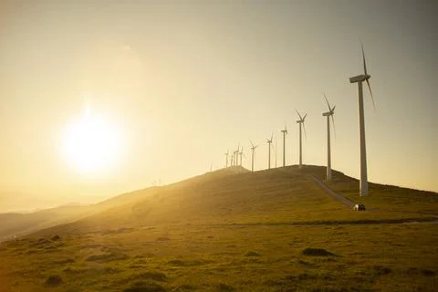 Wind generators in the mountains at sunset Stock Photos