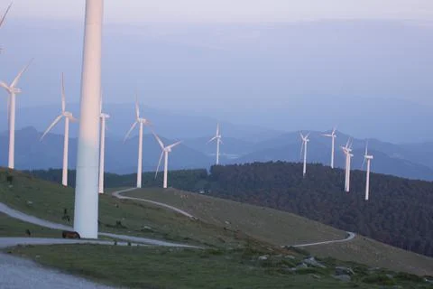 Wind generators in the mountains at sunset Stock Photos