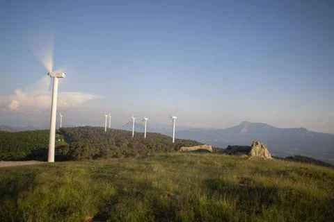Wind generators in the mountains at sunset Stock Photos