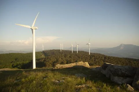Wind generators in the mountains at sunset Stock Photos