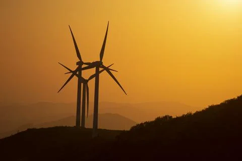Wind generators in the mountains at sunset Stock Photos
