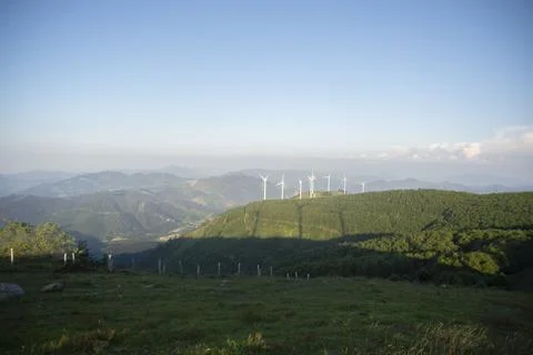 Wind generators in the mountains at sunset Stock Photos