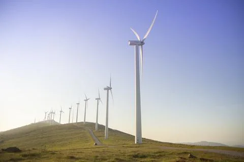 Wind generators in the mountains at sunset Stock Photos