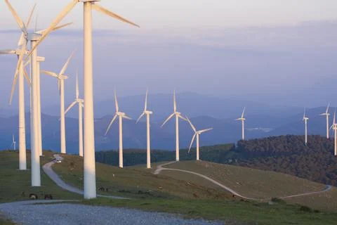 Wind generators in the mountains at sunset Stock Photos