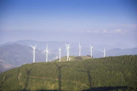 Wind generators in the mountains at sunset Stock Photos