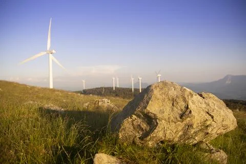 Wind generators in the mountains at sunset Foto stock