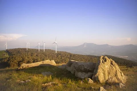 Wind generators in the mountains at sunset Stock Photos