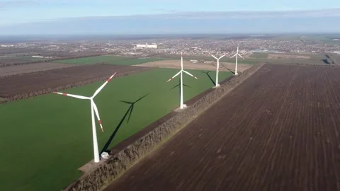 Wind generators over spring fields Stock Footage 169212384