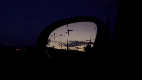 Wind generators relfected in rear mirror. Stock Footage 97465646