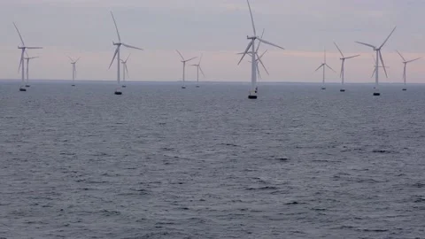 Wind generators rotate fast standing in Skagerrak strait Stock Footage 135443592