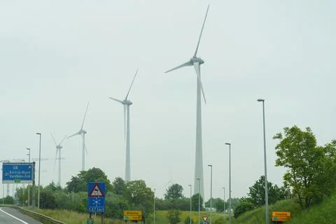 Wind generators stand along the road. Stock-Fotos