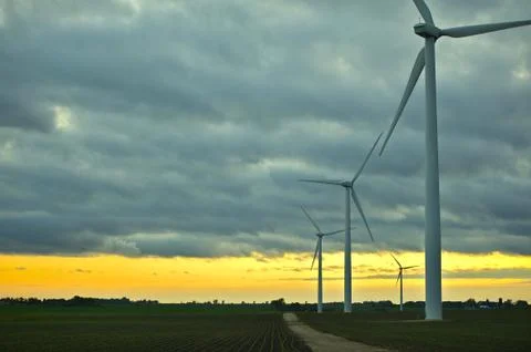 Wind generators sunset. wind turbines plantation. technology photo collection Stock Photos