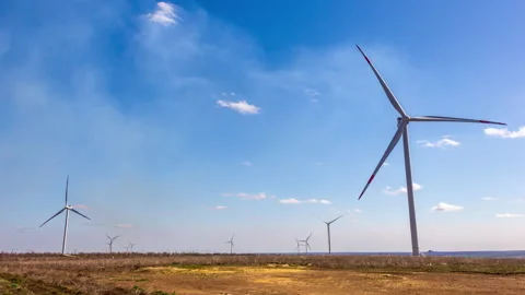 Wind Generators Turbines on a Field Stock Footage 147576923