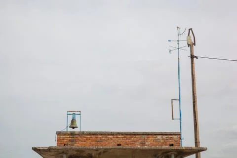 A wind indicator and a bell Stock Photos