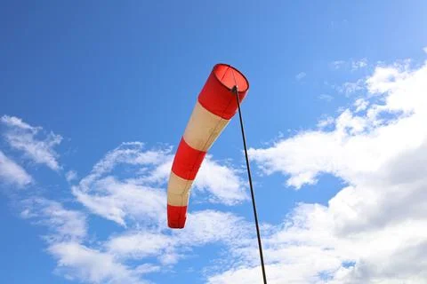 Wind indicator on the background of a blue sky with clouds 写真素材