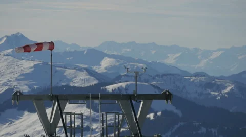 Wind indicator waving in the wind at Kitzbühel ski resort Video stock 61631595