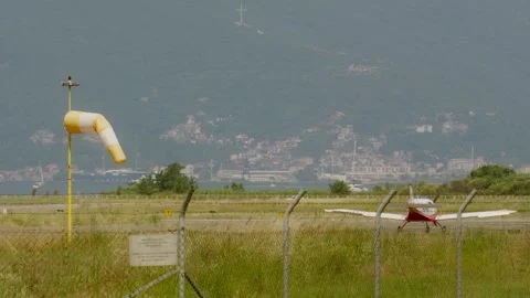 Wind indicators during a hot windless sunny day with views of the mountains Stock Footage 327012031